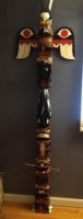 Photo of Cedar house post carved by Makah Grandfather Gordon Mummey