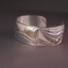 Photo of Hand carved sterling silver and 18Kt gold bracelet
