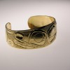 Photo of 18 Karat gold hand carved Timberwolf bracelet.